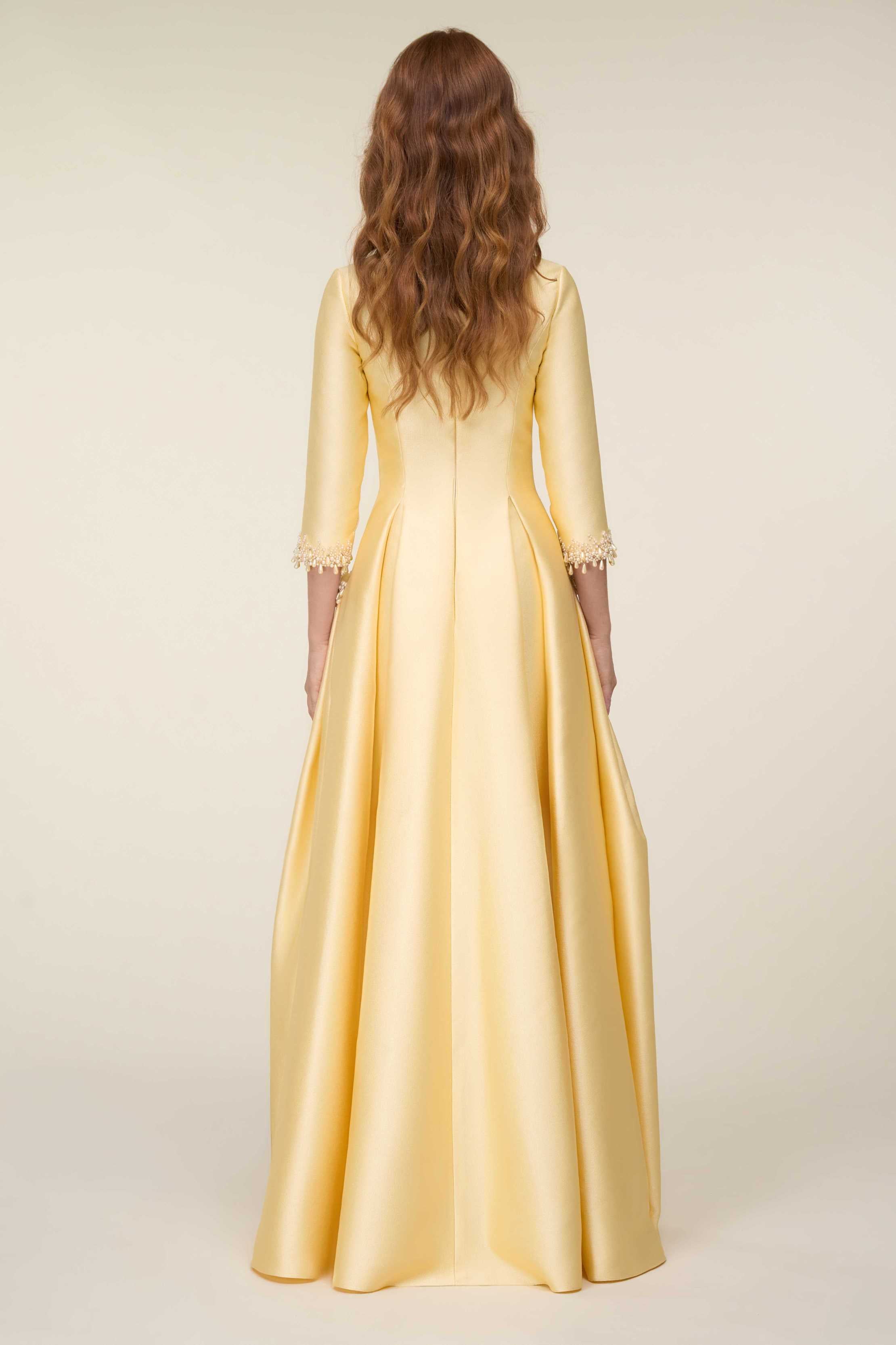 Structured Gown With Centre Front Slit Neckline And Pearl Embellished Accents.