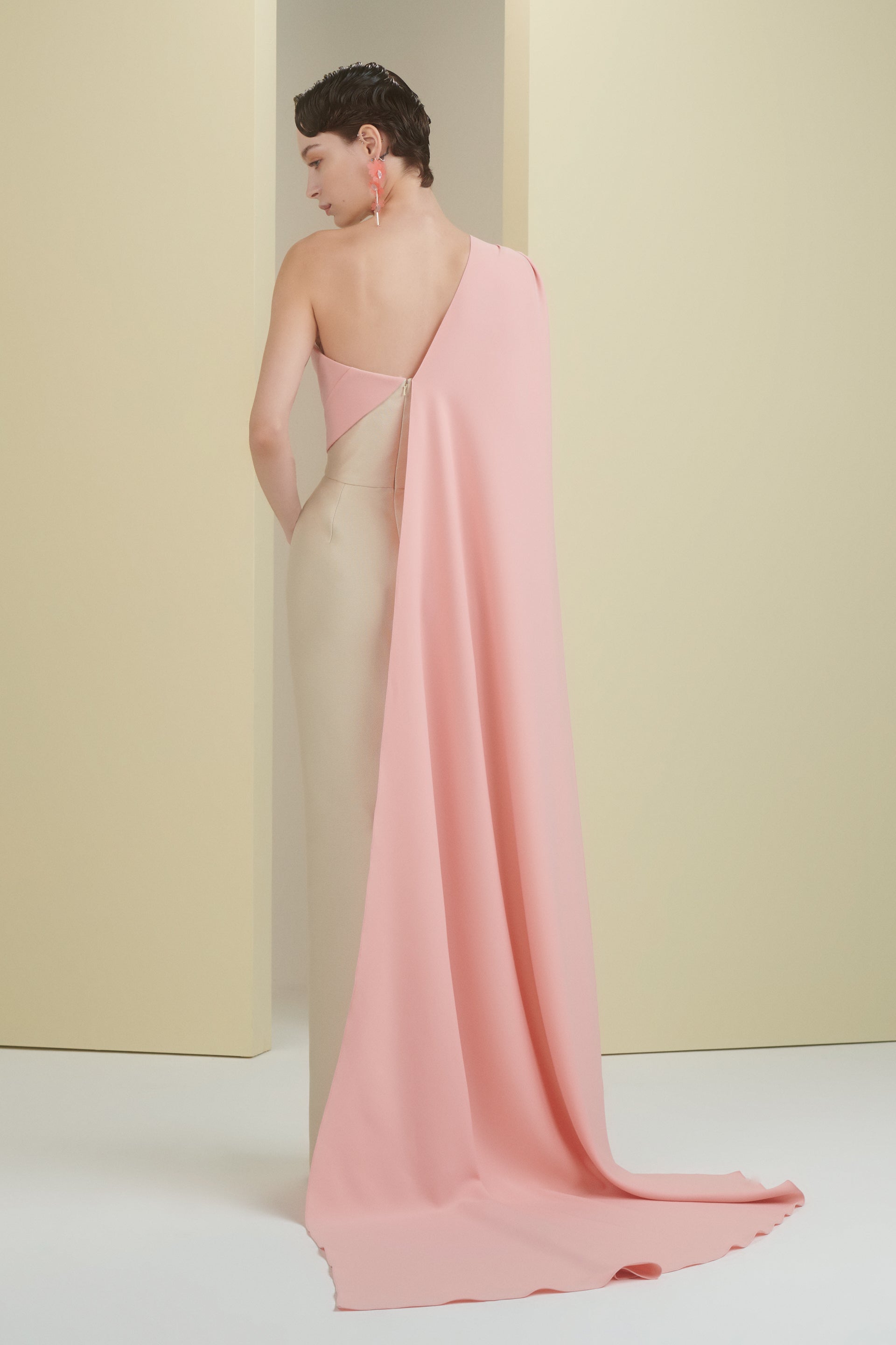one shoulder, cape dress, column dress, long dress, evening dress, full length, cream dress, peach dress, bow, beading dress, one shoulder cape dress, fitted dress, 3d embellished dress, asymmetrical neckline, red carpet dress, strapless dress, ready to wear designer, evening dress Dubai, buy dress Dubai, fashion designer Dubai, SS24 collection, Spring summer collection, gala dress