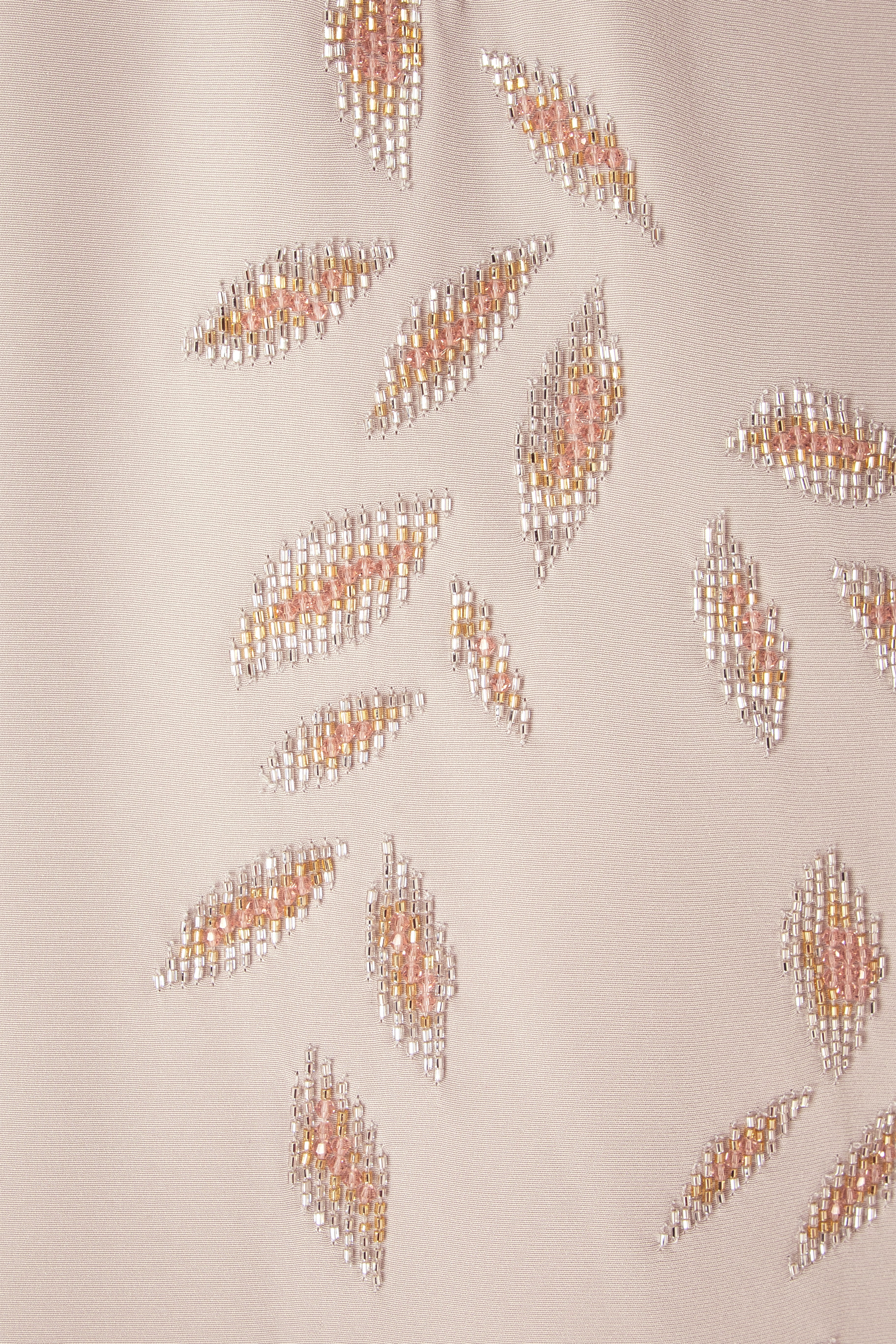 Sleek Gown With Deep Neckline And Intricate Embroidery