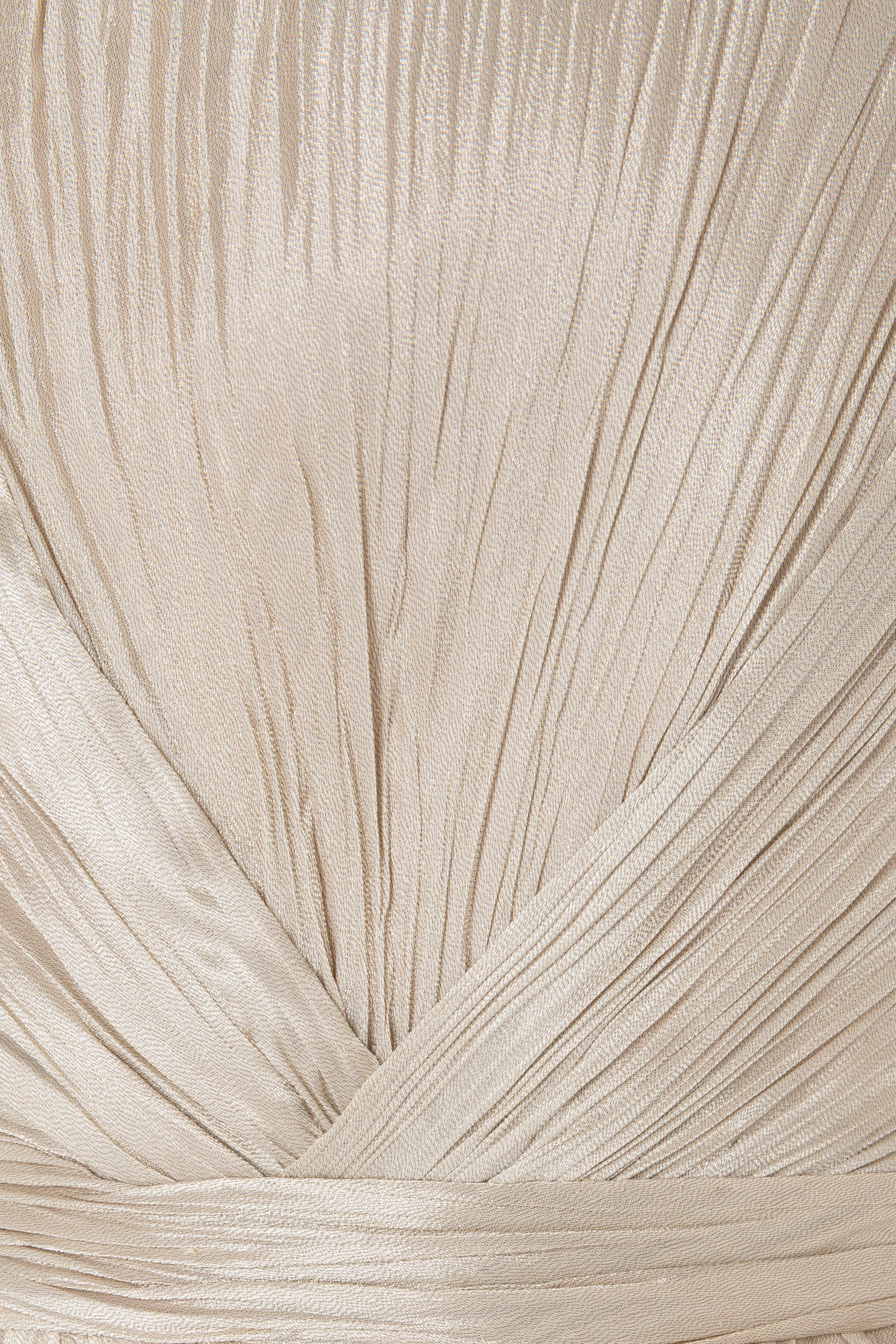 Strapless Lamé Pleated Gown With Asymmetrically Draped Bodice.