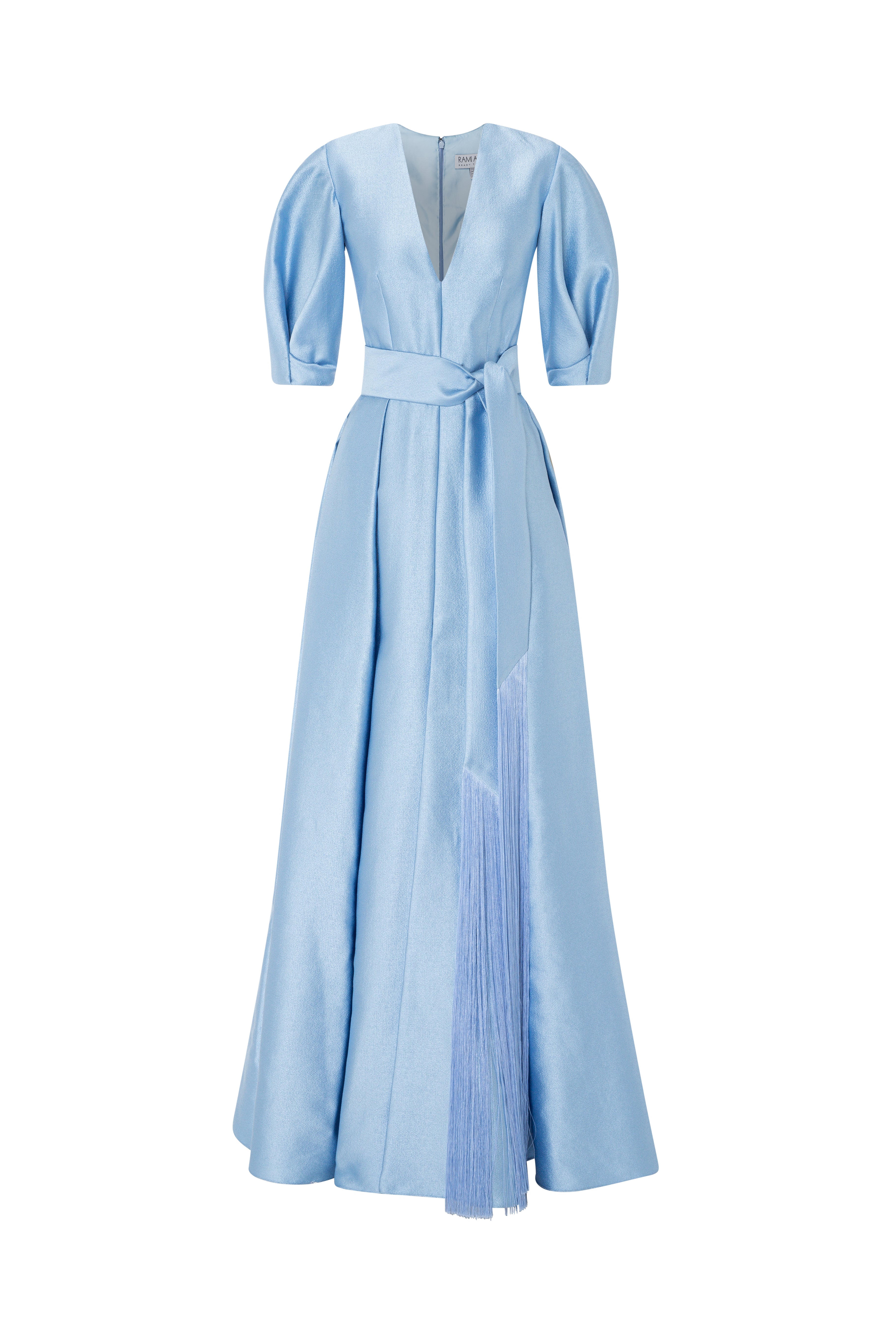 V-Neck Gown With Puff Sleeves And Fringed Sash Belt.