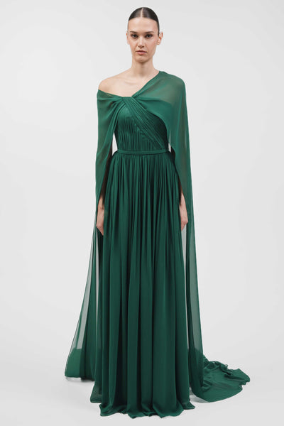 Asymmetrically Draped Muslin Gown With Cape Overlay And Flowing Silhouette.