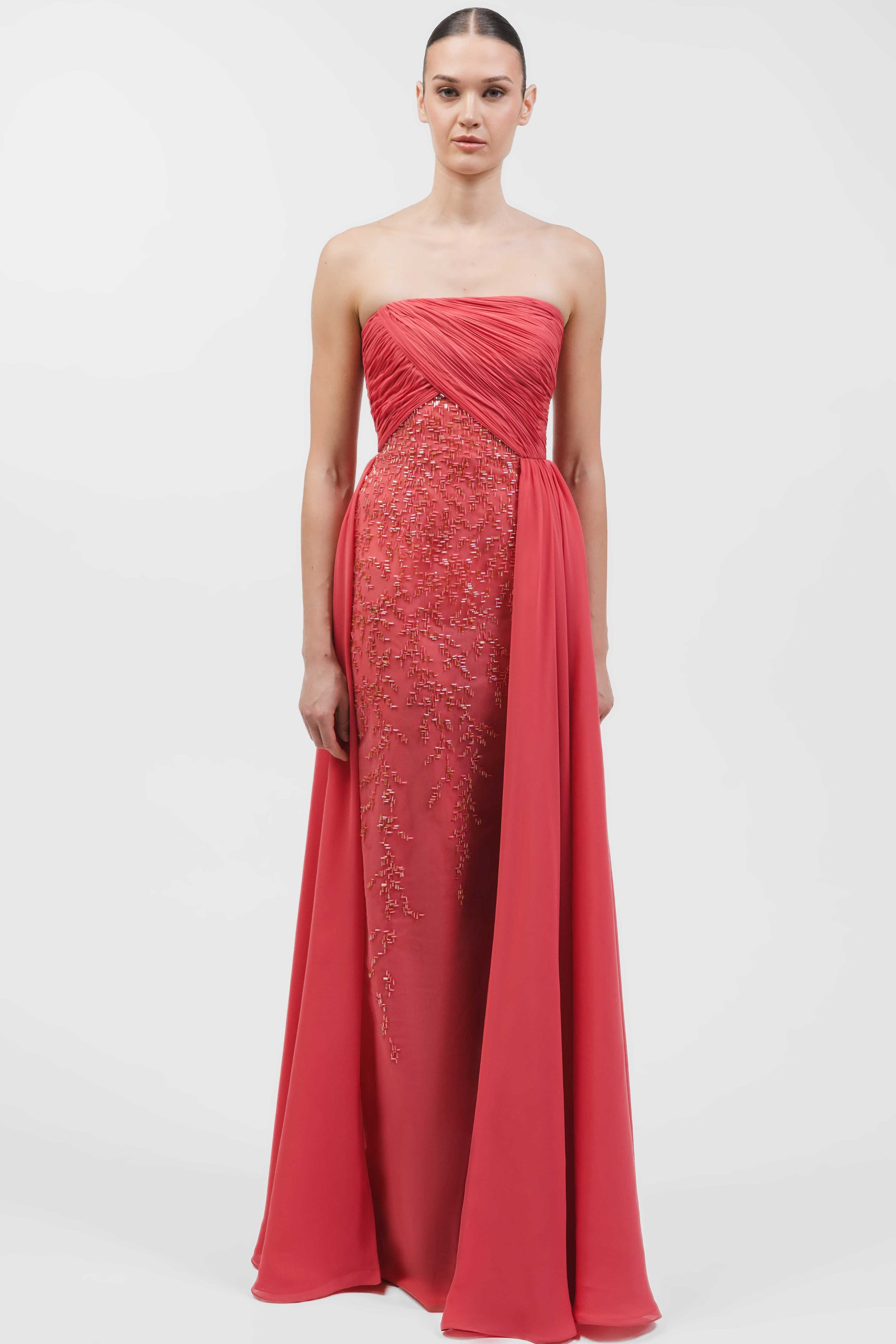 Strapless Asymmetrically Draped Gown With An Embellished Front Panel And Overskirt.