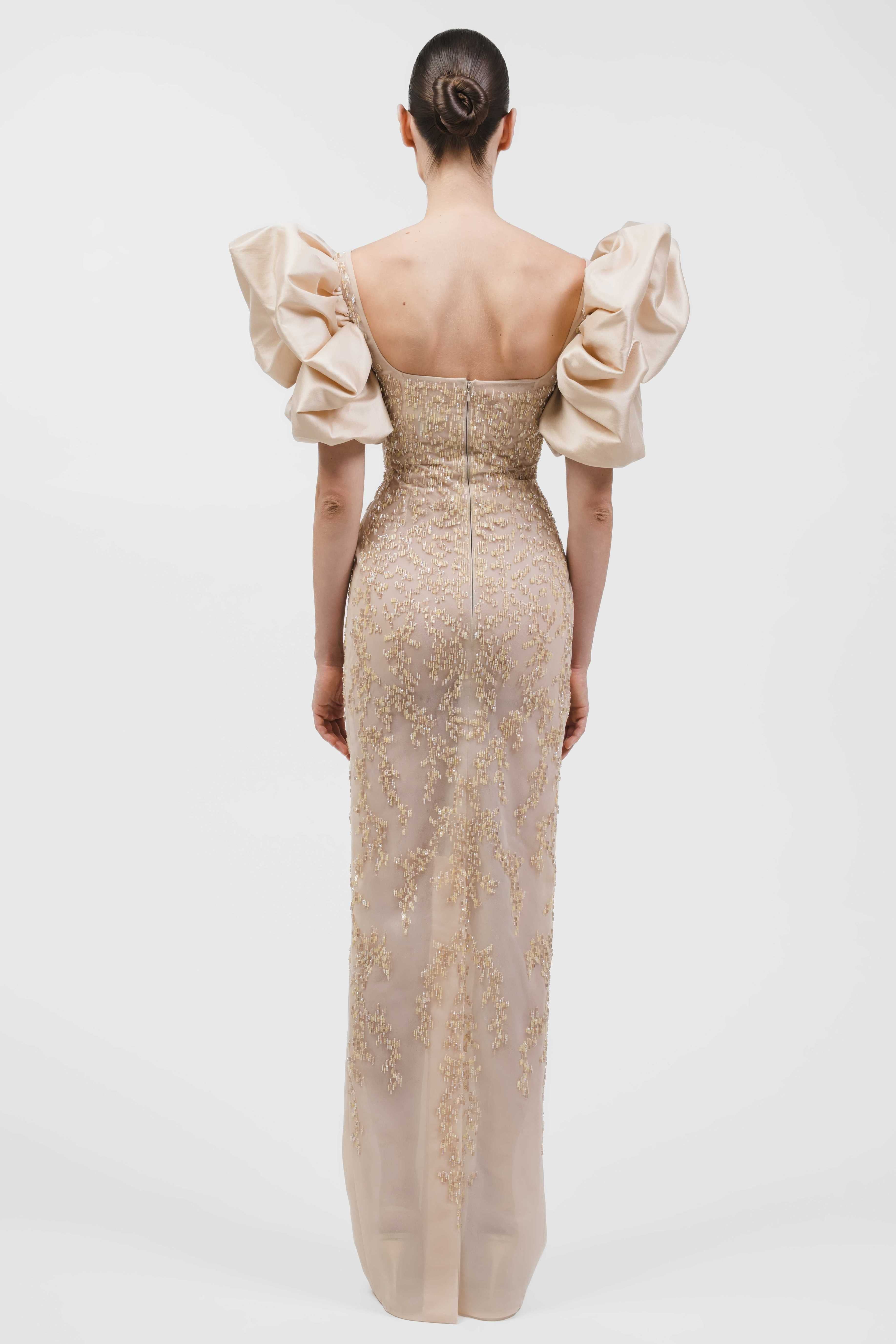 Fully Beaded Column Gown With Square Neckline And Voluminous Puff Sleeves.