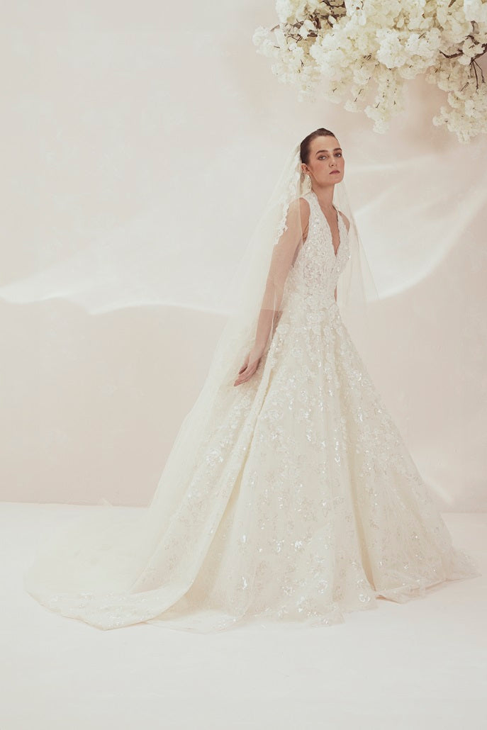 Sophisticated Halter-Neck Wedding Gown Adorned With Intricate Embroidery And Embellishments