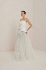 Strapless Gown With Fully Beaded Sunray Pleated Skirt And Asymmetrically Alaced Bows