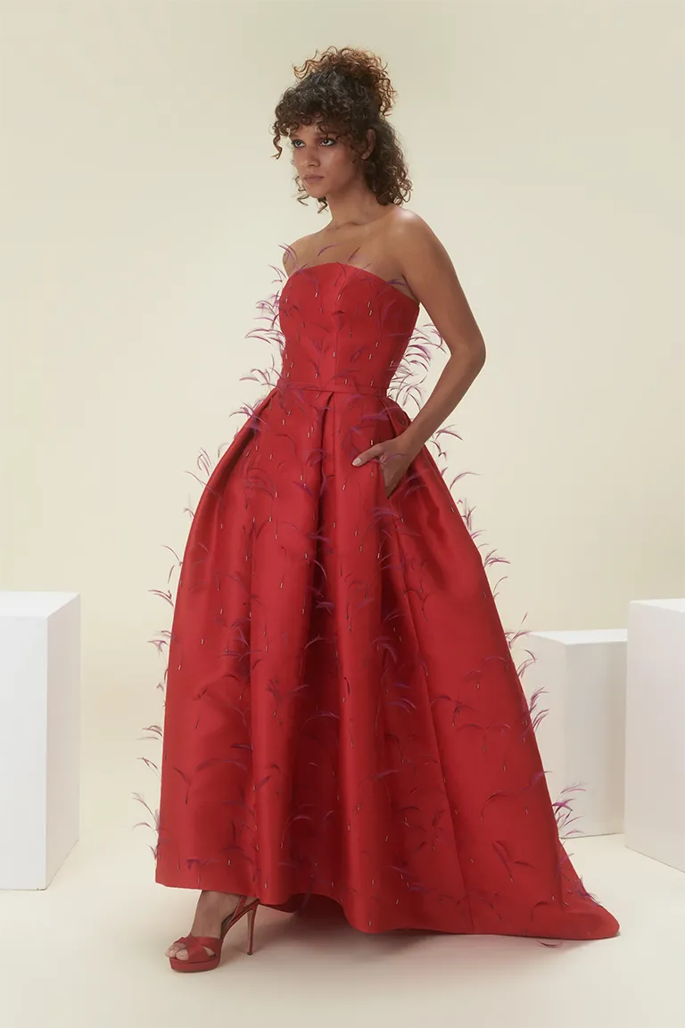 stapless dress,  full length, satin dress, Aline dress, gown dress, intricate feathers dress, red dress, pockets dress, long dress, evening dress, red carpet dress,  ready to wear designer, evening dress Dubai, buy dress Dubai, fashion designer Dubai, Autumn-Winter collection, gala dress