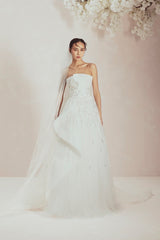 Wedding Gown Fully Adorned With Lines Of Sequins, Showcasing Asymmetric Soft Structured Folds