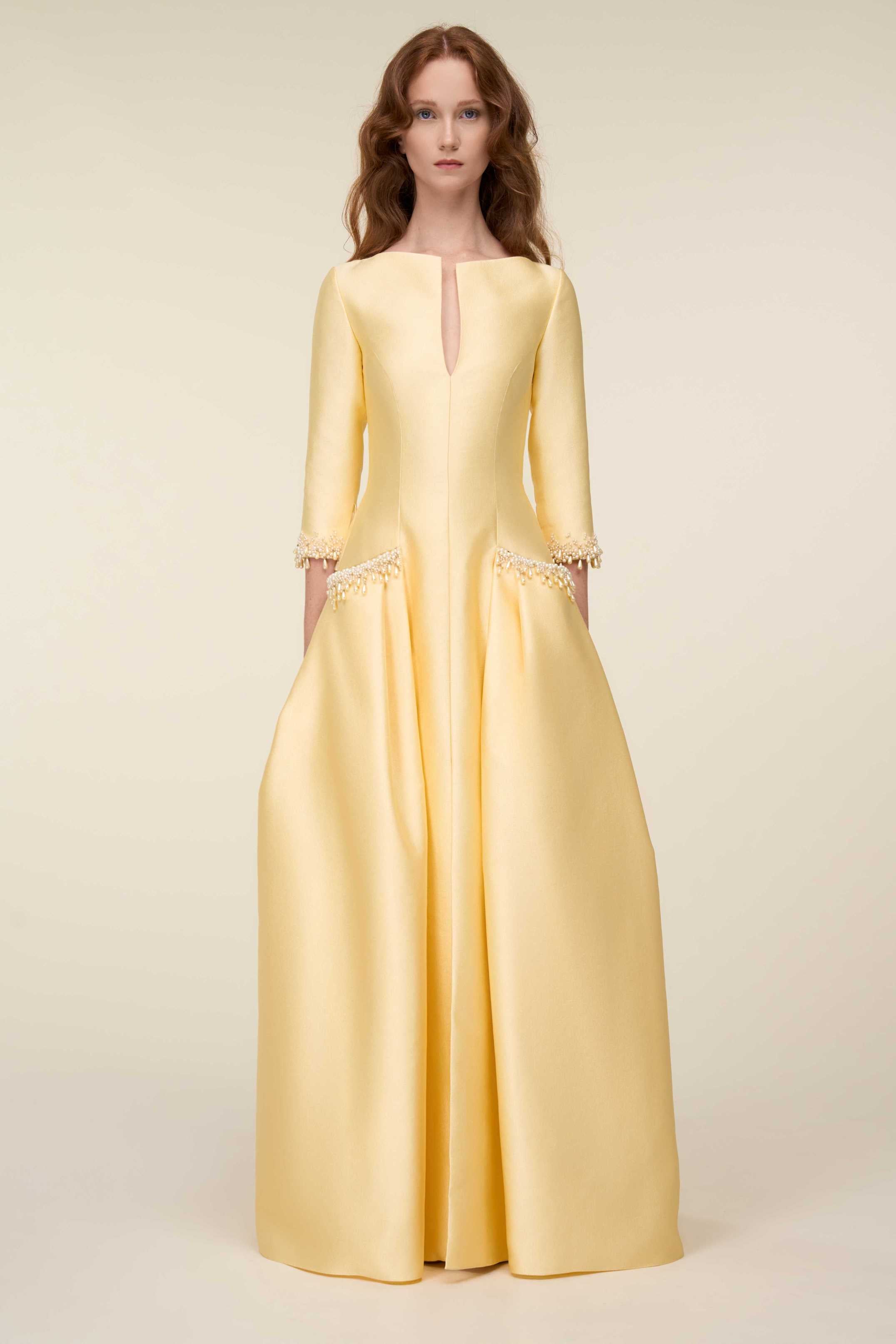 Structured Gown With Centre Front Slit Neckline And Pearl Embellished Accents.