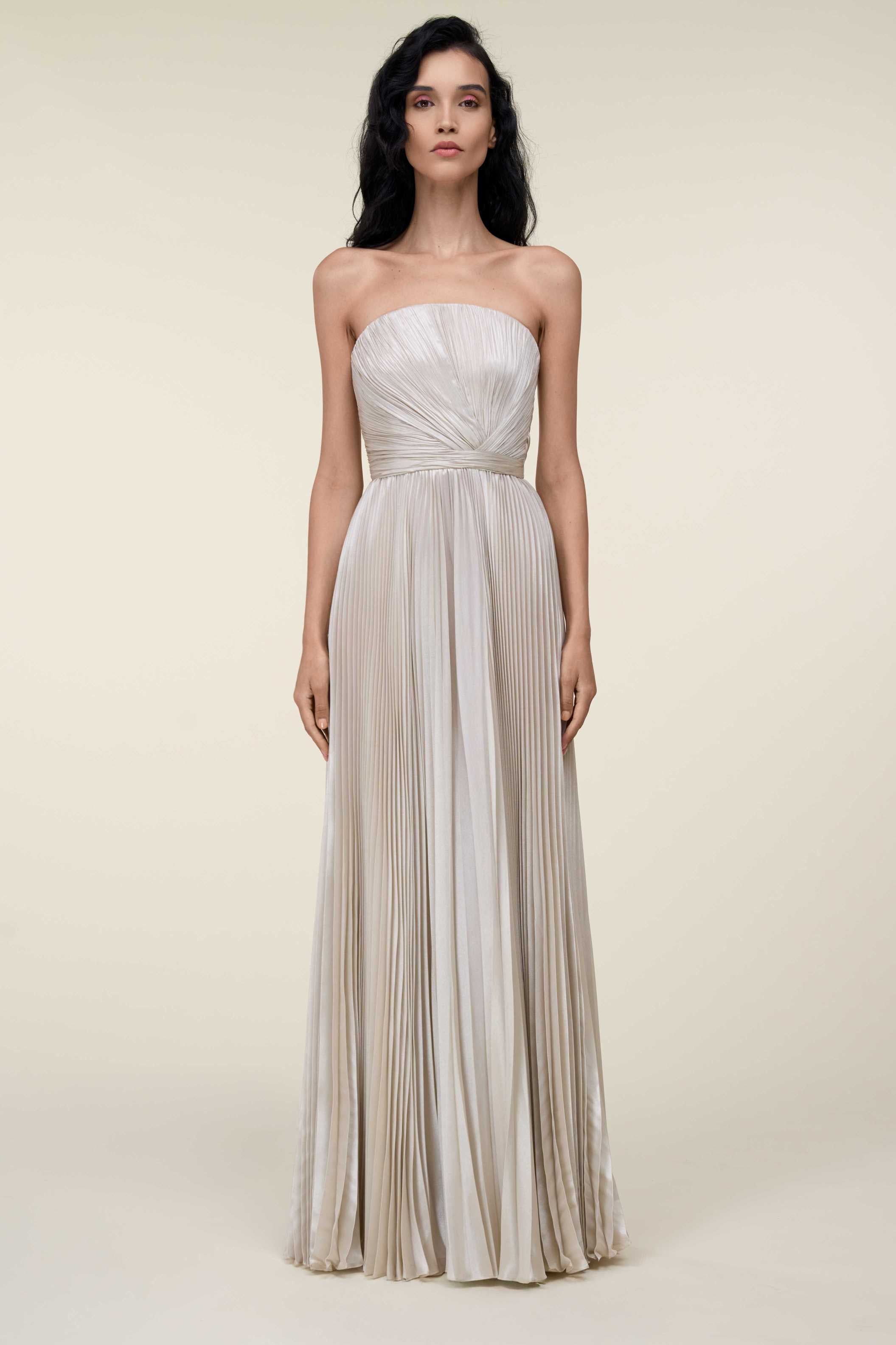 Strapless Lamé Pleated Gown With Asymmetrically Draped Bodice.