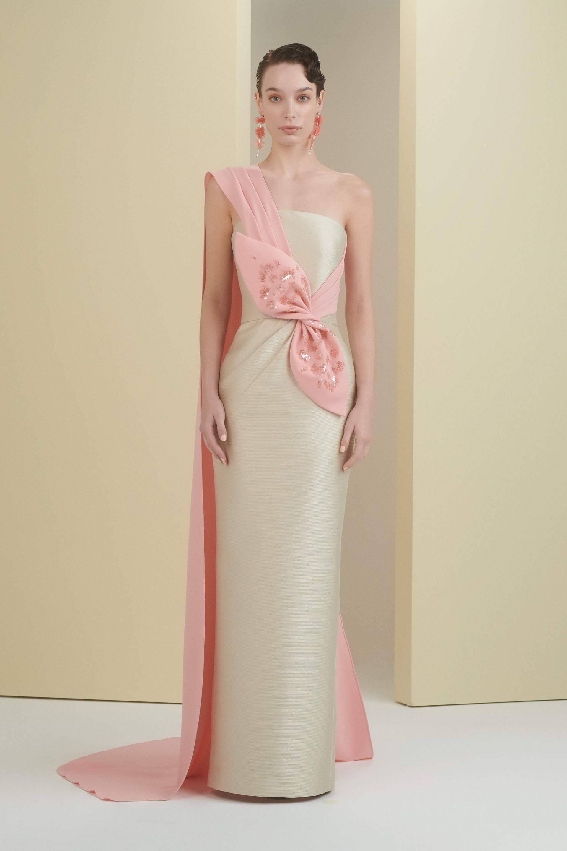 one shoulder, cape dress, column dress, long dress, evening dress, full length, cream dress, peach dress, bow, beading dress, one shoulder cape dress, fitted dress, 3d embellished dress, asymmetrical neckline, red carpet dress, strapless dress, ready to wear designer, evening dress Dubai, buy dress Dubai, fashion designer Dubai, SS24 collection, Spring summer collection, gala dress