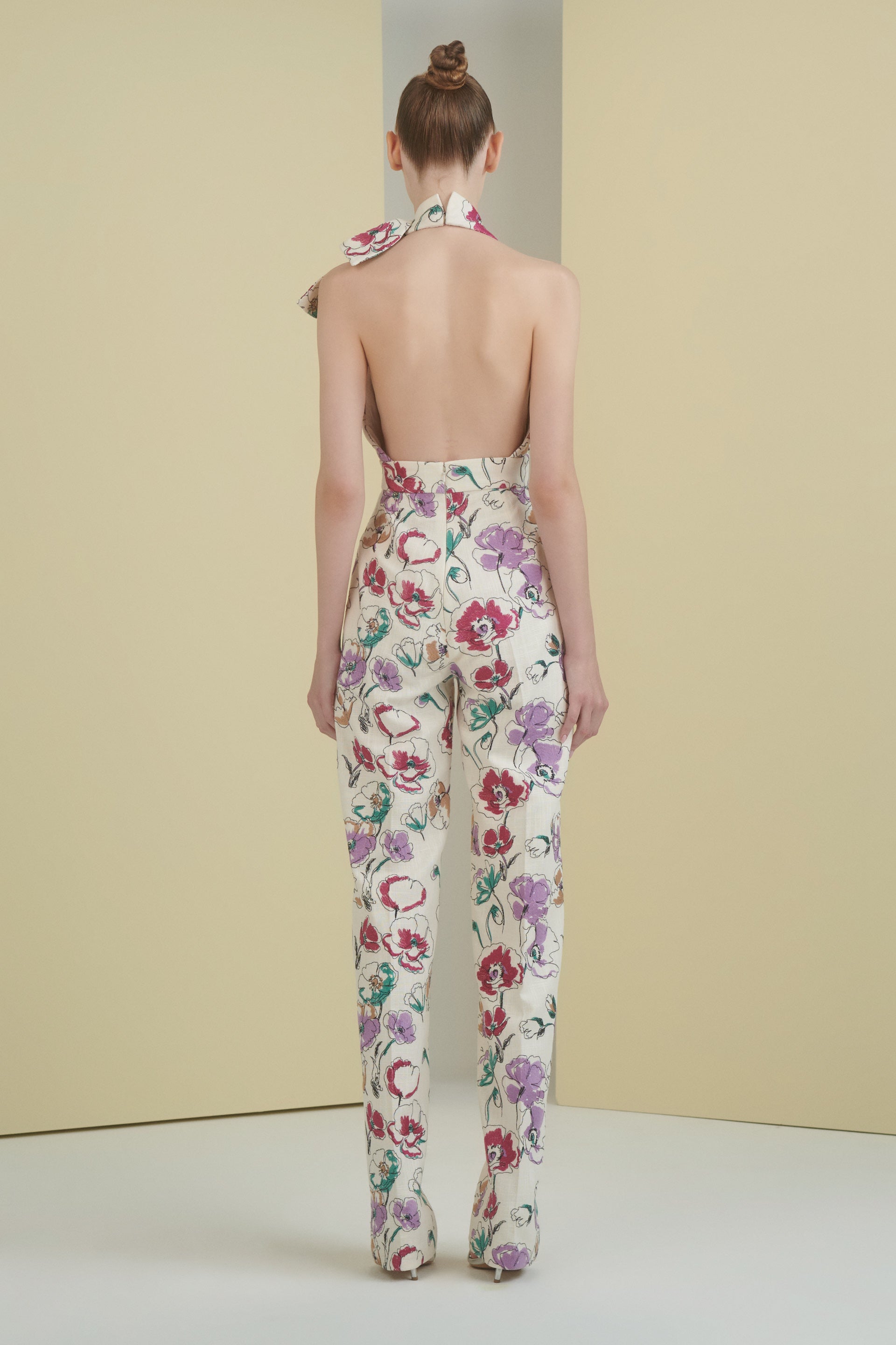 linen jumpsuit, floral, florals, embroidered linen, linen jumpsuit, halter neckline, cream, bow detail, backless jumpsuit, wide leg pant, ready to wear designer, evening dress Dubai, buy dress Dubai, fashion designer Dubai, SS24 collection, Spring summer collection, gala dress
