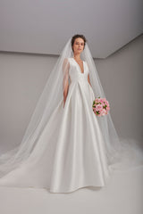 Silky V-neckline box-pleated wedding gown with long train