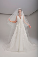 Fully embellished floral tulle volume wedding dress with cascading train