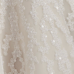 Richly embroidered off-shoulder wedding dress with paneled skirt